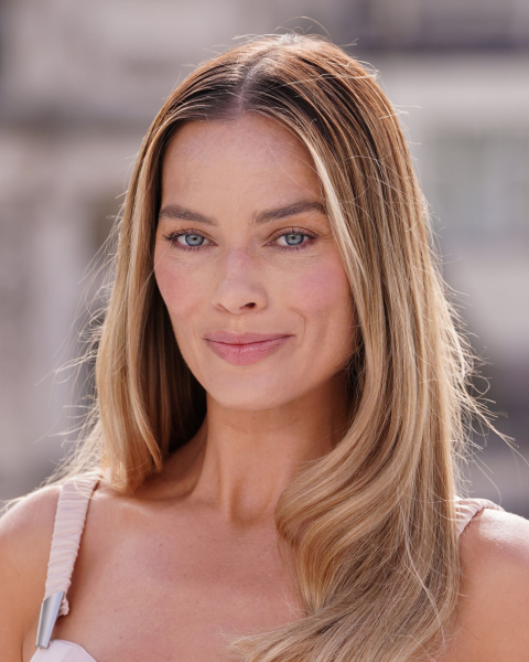 Closeup shot of Margot Robbie with cinnamon toast hair